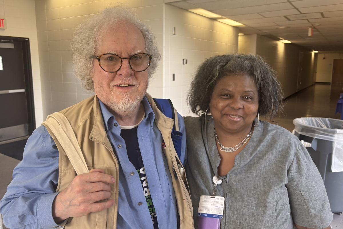 Jack Keene standing with a member of the Jones Building staff