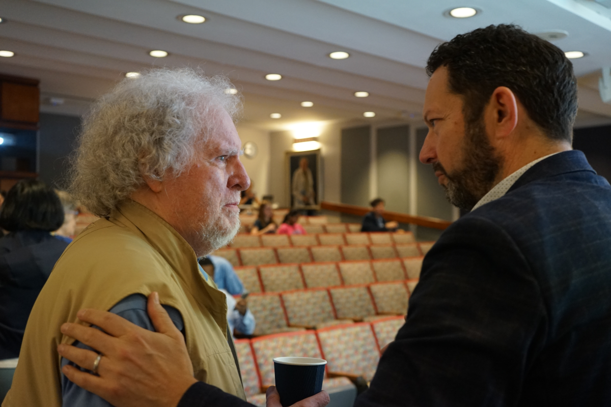Jack Keene shaking hands with Micah Luftig