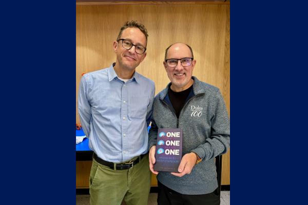 Archibald with Joseph Heitman holding a copy of Archibald's book