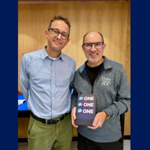 Archibald with Joseph Heitman holding a copy of Archibald's book